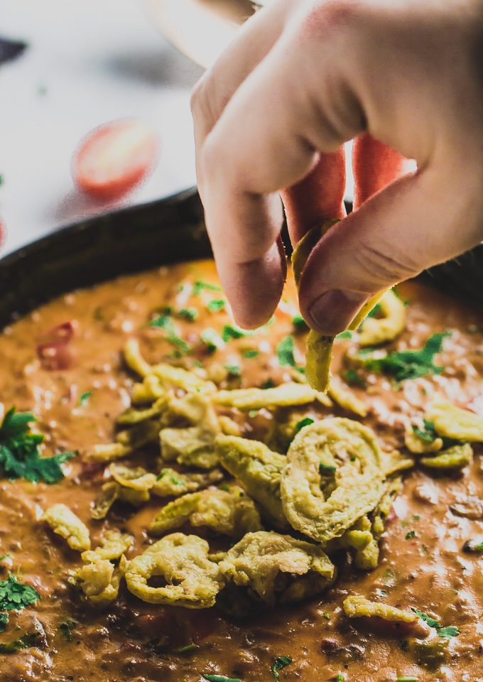 A totally scoopable combo of taco meat, veggies and cheese in an easy to make queso that satisfies everyone's urge for a party dip|www.mannaandspice.com